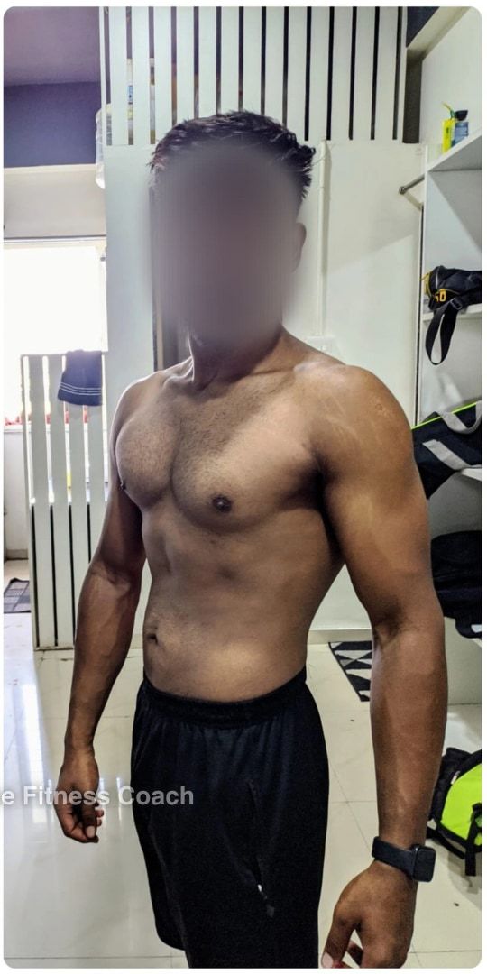 Abhijay after: shirtless in a gym, noticeably leaner and more muscular, face blurred.
