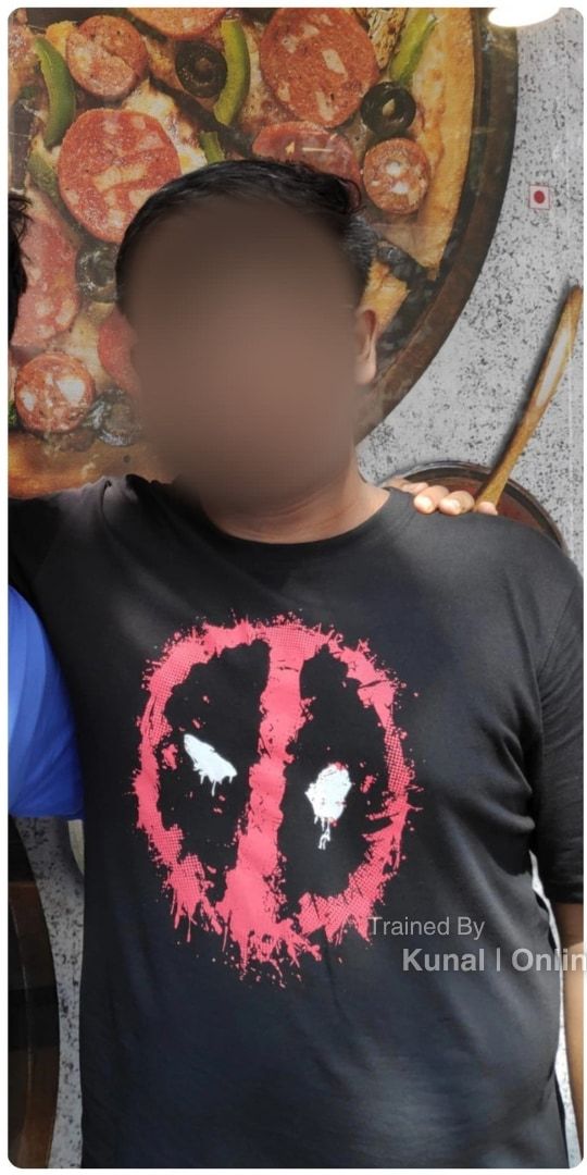 Abhijay before: in a black T-shirt, arm around a friend, face blurred.