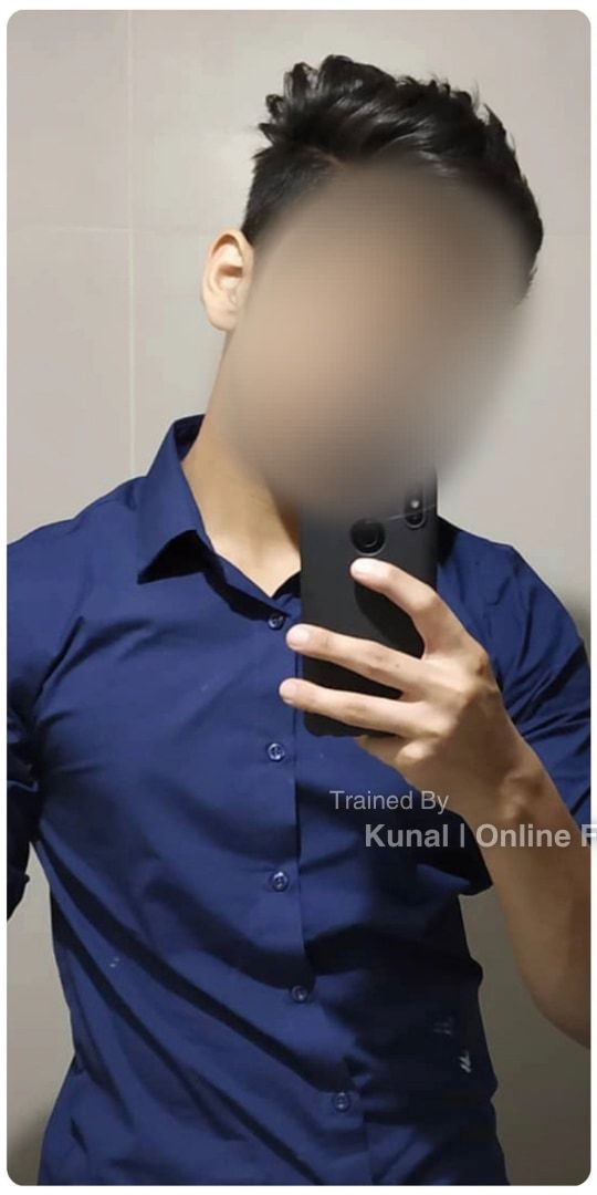 Sid before: a mirror selfie in a blue shirt, head and shoulders, face blurred.